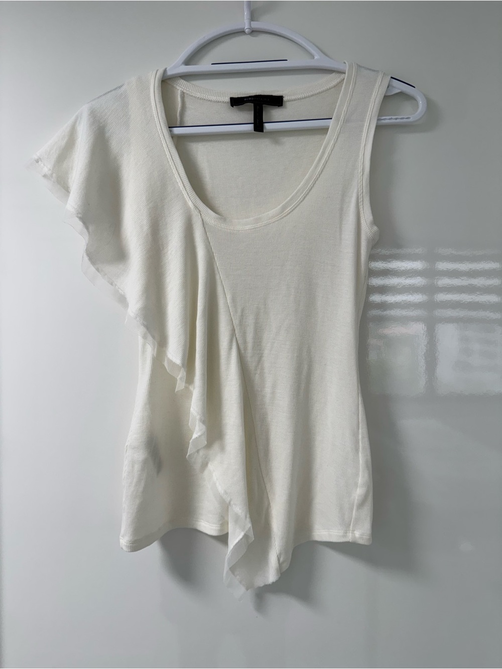 BCBGMaxAzria Asymmetrical Ivory Sleeveless Tank Featuring Sheer Front Ruffle. XS